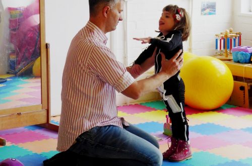 Girl in Mollii Suit with Dad at CPotential