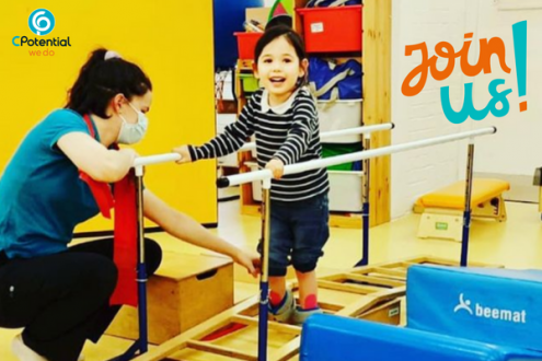 Girl walking in parallel bars in physiotherapy at CPotential