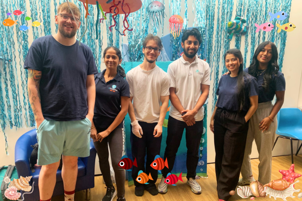 2 physiotherapy students with 4 CPotential clinicians standing infront of an 'under the sea' backdrop for Summer Intensives at CPotential